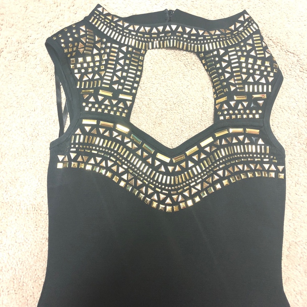 Bebe brand black dress with gold detail.